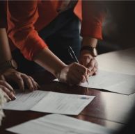 Couple signing documents
