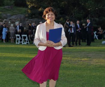 Yasmin conducting an outdoor ceremony